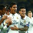 Real Madrid's French defender Raphael Varane (C) celebrates with teammates after scoring a goal during their UEFA Champions League Group F match against Borussia Dortmund, at BVB stadium in Dortmund, on September 27, 2016