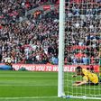 England's striker Jermain Defoe (L) scores against Lithuania at Wembley Stadium in London on March 26, 2017