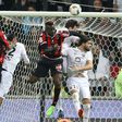 Nice's forward Mario Balotelli (C) heads the ball during the French L1 football match Nice vs Caen on February 10, 2017 at the Allianz Riviera stadium in Nice, southeastern France