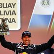 Peugeot's driver Stephane Peterhansel holds his trophy on the podium of the 2017 Rally Dakar in Buenos Aires, Argentina on January 14, 2017