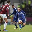 Chelsea's Eden Hazard (R) passes the ball during their English Premier League match against Burnley, at Turf Moor in Burnley, on February 12, 2017