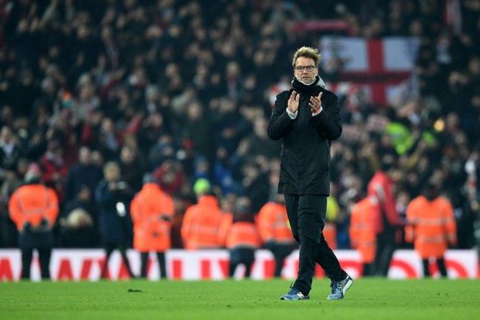 Liverpool manager Jurgen Klopp applauds the fans following the English Football League Cup semi-final second-leg football match between Liverpool and Southampton at Anfield on January 25, 2017, after Southampton won 1-0