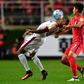 South Korea's Son Heung-Min (R) fights for the ball with Qatar's Pedro Correia (L) during their 2018 World Cup qualifying match in Suwon, south of Seoul, on October 6, 2016