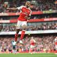 Theo Walcott celebrates after scoring Arsenal's second goal against Swansea City at the Emirates Stadium on October 15, 2016