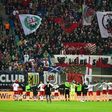 Leipzig's players celebrate with their fans after a German first division Bundesliga football match on November 6, 2016