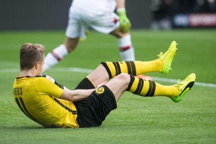 Dortmund's forward Marco Reus falls during the German First division Bundesliga football match against Bayer 04 Leverkusen March 4, 2017