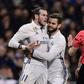Real Madrid's Welsh forward Gareth Bale (L) argues with the referee as teammates try to stop him during their match against D Las Palmas at the Santiago Bernabeu stadium in Madrid on March 1, 2017