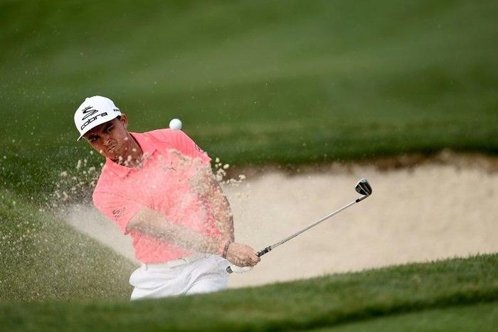 Rickie Fowler of the US hits his third shot from a greenside bunker on the 15th hole during the first round of the Shell Houston Open, in Humble, Texas, on March 30, 2017