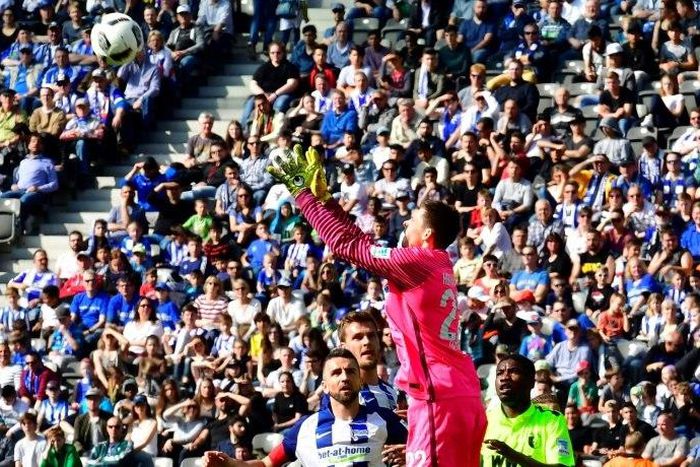 Berlin's Rune Almenning Jarstein makes a save during their match against Augsburg in Berlin on April 9, 2017