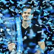 Britain's Andy Murray celebrates with the trophy after winning the men's singles final on the eighth and final day of the ATP World Tour Finals tennis tournament in London November 20, 2016