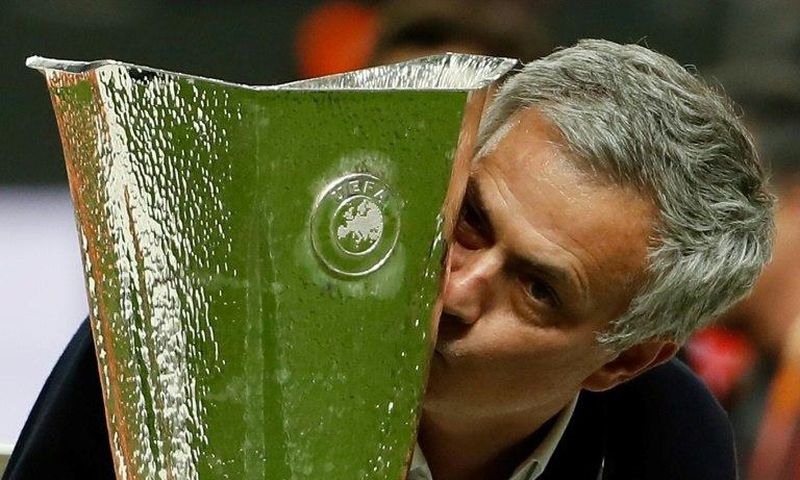Manchester United manager Jose Mourinho kisses the trophy after his side beat Ajax in Stockholm to win the Europa League on May 24, 2017