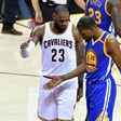 LeBron James of the Cleveland Cavaliers and Kevin Durant of the Golden State Warriors speak after a foul in the third quarter in Game 4 of the 2017 NBA Finals June 9, 2017