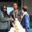 Serena Williams (L) leaves after attending her sister Venus Williams' tennis match against Japan's Kurumi Nara at the French Open