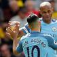 Manchester City's defender Vincent Kompany (R) celebrates scoring against Watford with striker Sergio Aguero on May 21, 2017