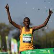 Kenya's Paul Lonyangata raises the arms as he crosses the finish line to win the 41st Paris Marathon in Paris on April 9, 2017