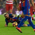 Barcelona's Argentinian forward Lionel Messi fights for the ball on the field during the Spanish league football match between FC Barcelona and Granada FC at the Camp Nou stadium in Barcelona on October 29, 2016