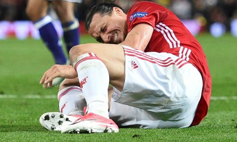 Zlatan Ibrahimovic reacts after injuring his knee during Manchester United's UEFA Europa League quarter-final second leg against Anderlecht at Old Trafford in Manchester, on April 20, 2017