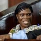Former Ivorian first lady Simone Gbagbo (L) talks to her lawyer at the Abidjan's courthouse on October 10, 2016 before the re-opening of her trial, during which she was prevented from leaving the courtroom by military police November 29, 2016