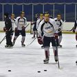South Korea's ice hockey team coach Jim Paek (R) conducts a team training session at a rink in Goyang, north-west of Seoul