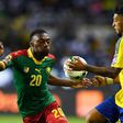 Cameroon's forward Karl Toko Ekambi (L) challenges Gabon's forward Denis Bouanga during the 2017 Africa Cup of Nations group A football match between Cameroon and Gabon at the Stade de l'Amitie Sino-Gabonaise in Libreville on January 22, 2017
