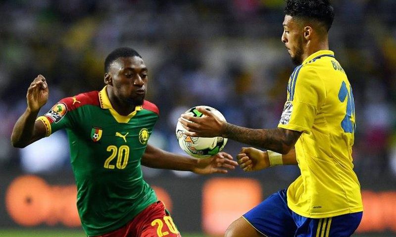 Cameroon's forward Karl Toko Ekambi (L) challenges Gabon's forward Denis Bouanga during the 2017 Africa Cup of Nations group A football match between Cameroon and Gabon at the Stade de l'Amitie Sino-Gabonaise in Libreville on January 22, 2017