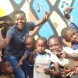 Wiyaala poses for photos at the Djimba World Music Festival venue with kids