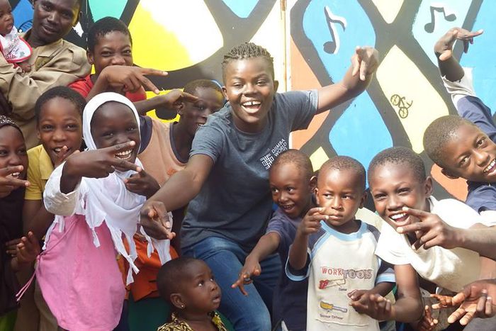 Wiyaala poses for photos at the Djimba World Music Festival venue with kids