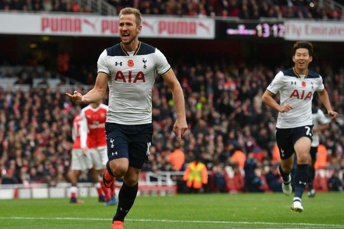 Tottenham Hotspur and England striker Harry Kane (left) celebrates scoring against Arsenal at the Emirates Stadium in London on November 6, 2016