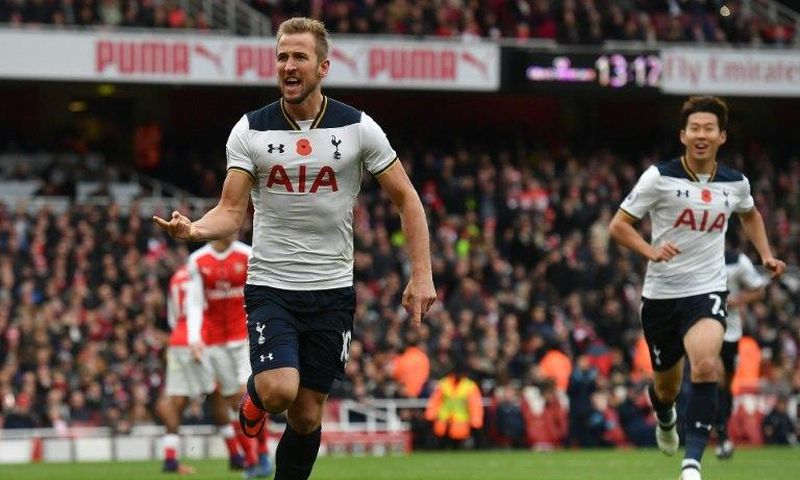 Tottenham Hotspur and England striker Harry Kane (left) celebrates scoring against Arsenal at the Emirates Stadium in London on November 6, 2016