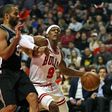 Rajon Rondo of the Chicago Bulls moves against Tony Parker of the San Antonio Spurs at the United Center in Chicago