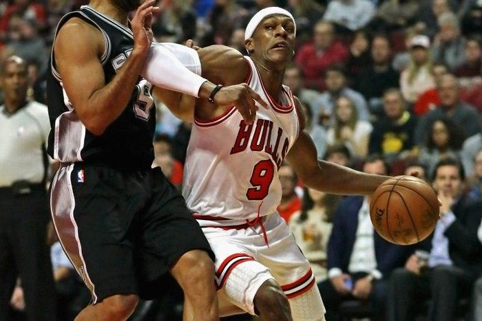 Rajon Rondo of the Chicago Bulls moves against Tony Parker of the San Antonio Spurs at the United Center in Chicago