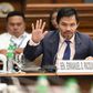 Manny Pacquiao (R) is juggling his boxing career with his role as a senator in the Philippines