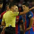 The referee shows the red card to Barcelona's Uruguayan forward Luis Suarez (R) during the Spanish Copa del Rey semi final second leg football match FC Barcelona vs Club Atletico de Madrid at the Camp Nou stadium in Barcelona on February 7, 2017