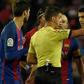 The referee shows the red card to Barcelona's Uruguayan forward Luis Suarez (R) during the Spanish Copa del Rey semi final second leg football match FC Barcelona vs Club Atletico de Madrid at the Camp Nou stadium in Barcelona on February 7, 2017
