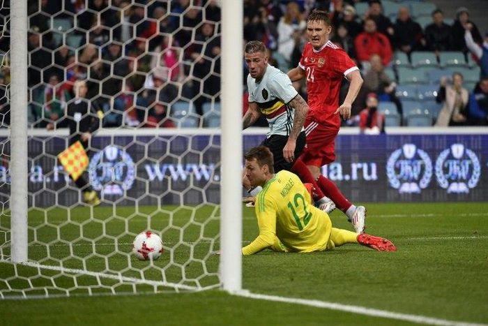 Russia's forward Alexander Bukharov scores a goal past Belgium's goalkeeper Simon Mignolet during an international friendly football match between Russia and Belgium at the Fisht Arena in Sochi on March 28, 2017