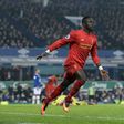 Liverpool's Senegalese midfielder Sadio Mane celebrates scoring his team's first goal during the English Premier League football match between Everton and Liverpool at Goodison Park in Liverpool, north west England on December 19, 2016