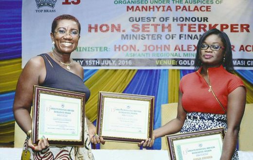 FROM LEFT: NANA EFUA ROCKSON (GROUP HEAD, CORPORATE AFFAIRS & MARKETING FOR GLICO GROUP) DISPLAYING THE AWARDS WITH JENNIFER SIRA DARTEH (BUSINESS DEVELOPMENT OFFICER FOR GLICO GENERAL) 