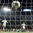 Real Madrid's goalkeeper Keylor Navas (2ndR) looks at the ball after Dortmund's midfielder Marco Reus' goal (L) during the UEFA Champions League football match Real Madrid CF vs Borussia Dortmund at the Santiago Bernabeu stadium on December 7, 2016