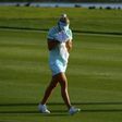 Lexi Thompson cries in a towel as she walks to the 18th green after her second shot during the final round of the ANA Inspiration on the Dinah Shore Tournament Course on April 2, 2017 in California