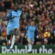 Liverpool's midfielder Sadio Mane (L) vies with Manchester City's midfielder Yaya Toure during the English Premier League football match December 31, 2016