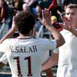 Roma's forward Edin Dzeko (R) celebrates with teammate Mohamed Salah after scoring on February 12, 2017