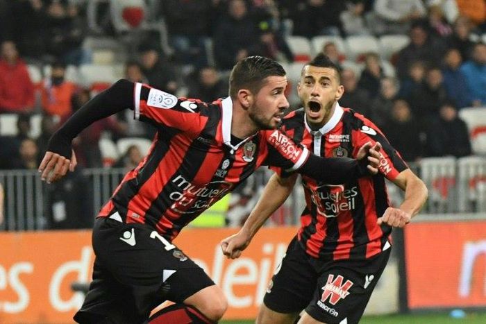 Nice's Mickael Le Bihan (L) celebrates after scoring against Montpellier HSC at the Allianz Riviera Stadium in Nice on February 24, 2017