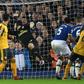 Everton defender Ashley Williams (2R) scores his team's second goal after a disputed corner award
