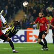 Fenerbahce's Moussa Sow bicycle-kicks the ball next to Manchester United's Marcos Rojo (L) and Daley Blind, in Istanbul, on November 3, 2016