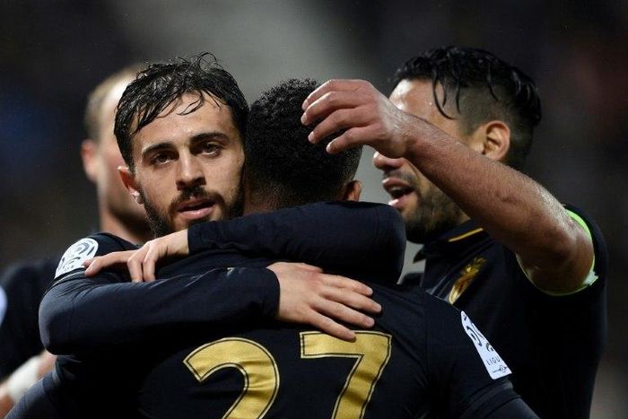 Monaco's Bernardo Silva (L) celebrates with teammates after scoring a goal against Nancy during their French Ligue 1 football match on May 6, 2017 in Tomblaine, eastern France