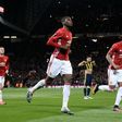 Manchester United's French midfielder Paul Pogba (C) celebrates scoring their first goal from the penalty spot against Fenerbahce at Old Trafford in Manchester, north west England, on October 20, 2016