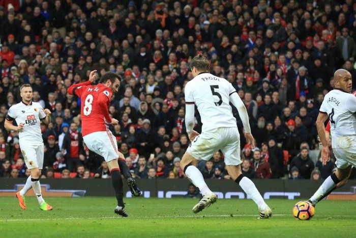 Manchester United's Juan Mata (2L) scores the opening goal during their match against Watford in Manchester on February 11, 2017.