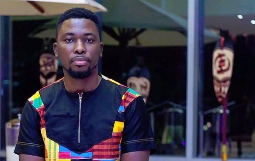 A Plus in a kente dress
