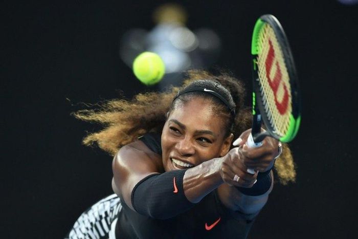 Serena Williams of the US hits a return against Venus Williams of the US during the women's singles final on day 13 of the Australian Open tennis tournament in Melbourne on January 28, 2017