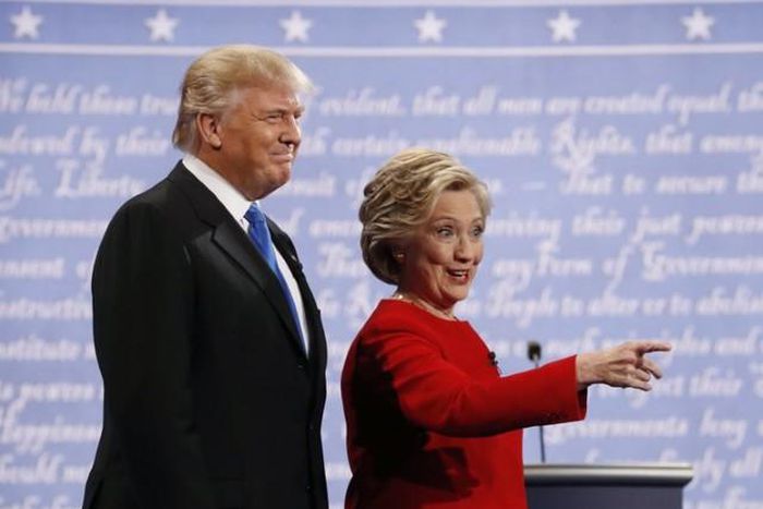 Republican U.S. presidential nominee Donald Trump and Democratic U.S. presidential nominee Hillary Clinton look on at the start of their first presidential debate at Hofstra University in Hempstead, New York, U.S., September 26, 2016.  